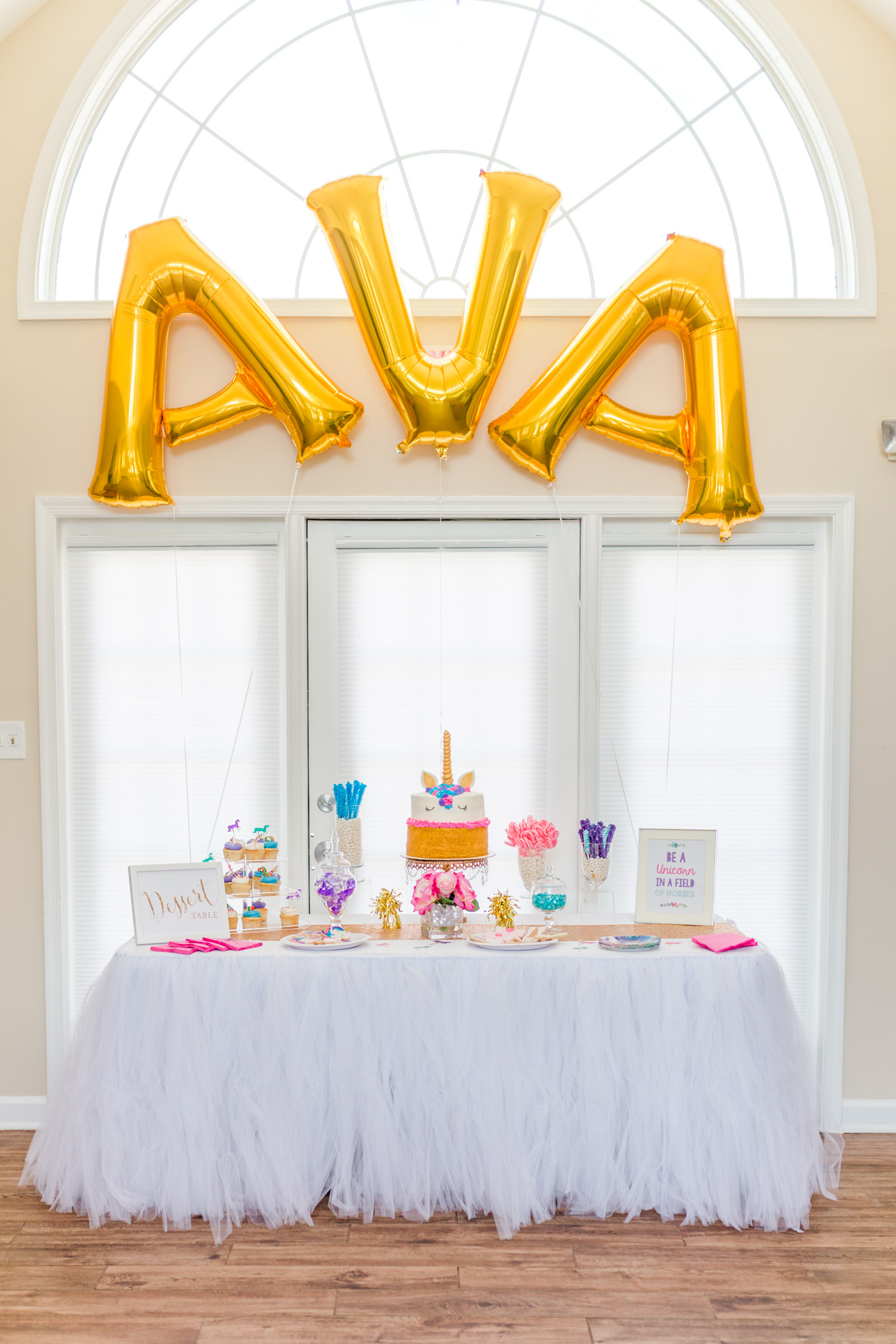 first birthday party, mylar balloons, unicorn cake