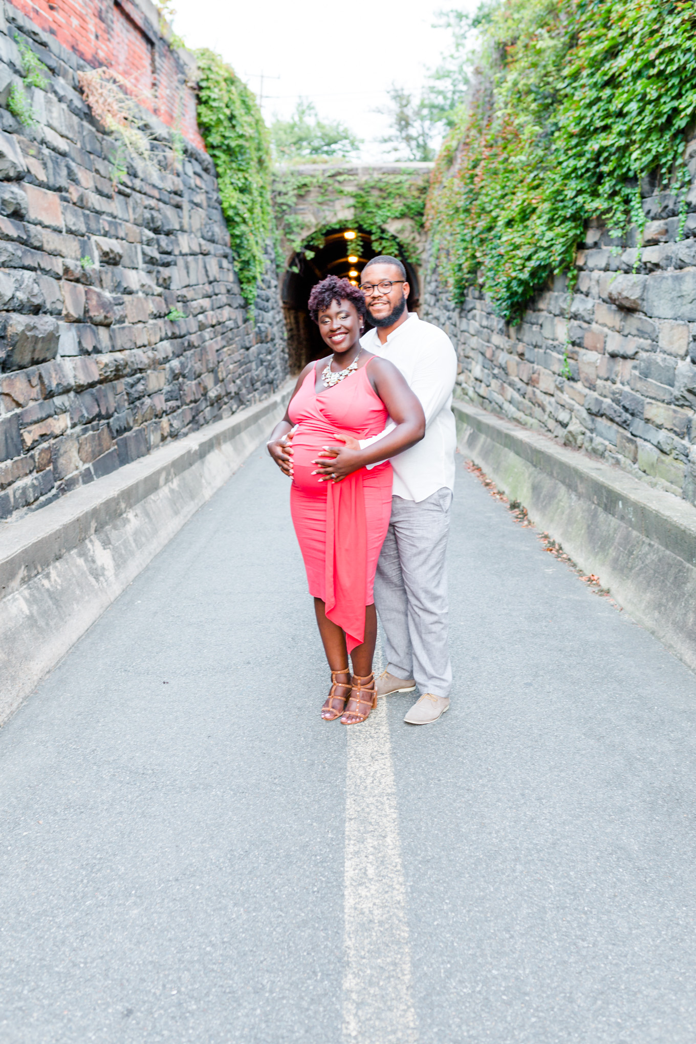 Wilkes Street Tunnel maternity photos, maternity style, coral dress, married couple, mom to be, dad to be, old town Alexandria, northern Virginia, maternity photographer, Alexandria maternity photographer, magic hour portraits, baby bump