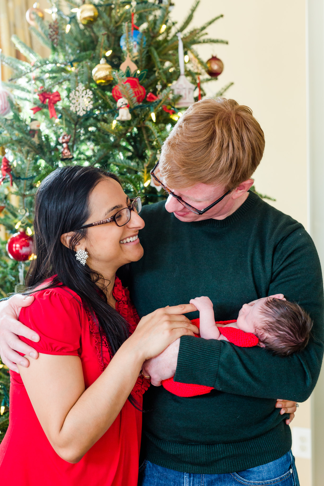 holiday newborn photos, newborn boy, baby boy, holiday photos, Christmas baby, brown haired baby, family of three, Christmas colors