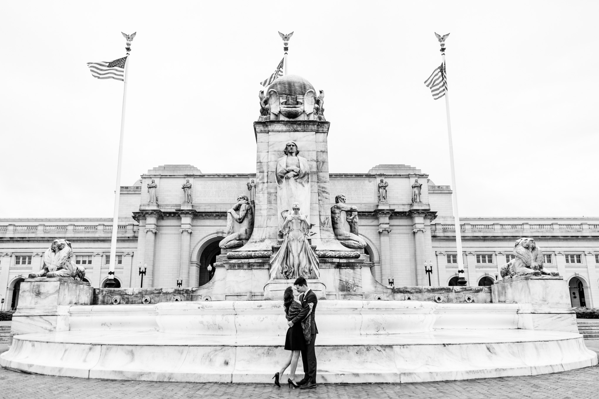 black and white engagement photos, black and white photography, black and white photos, engagement photos, black and white D.C., D.C. engagement photos, classic engagement photos, traditional engagement photos, engagement photos poses, classic architecture, D.C. architecture, Union Station D.C., Union Station, engaged couple, relationship goals, joyful couple, black and white sessions, fountain