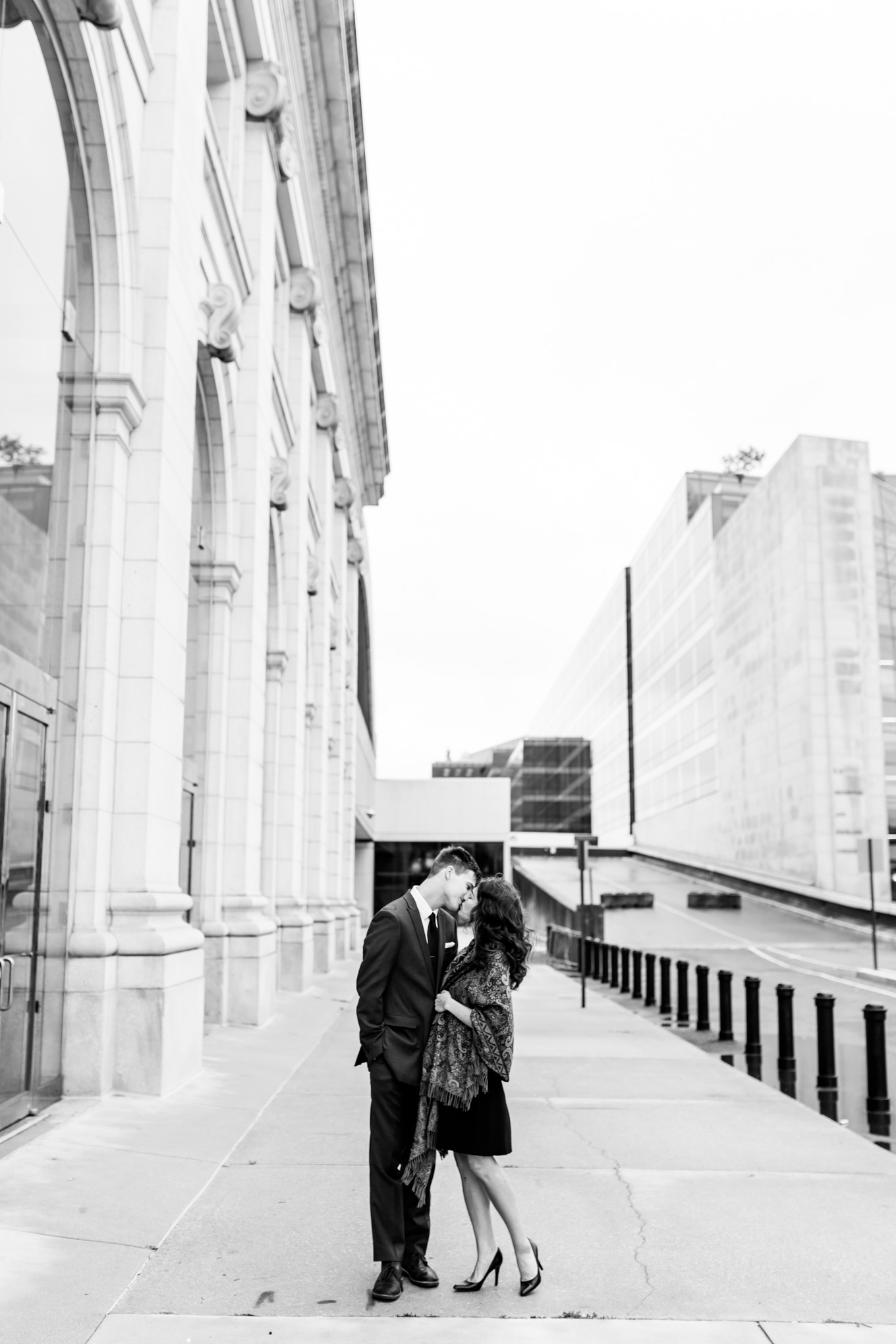 black and white engagement photos, black and white photography, black and white photos, engagement photos, black and white D.C., D.C. engagement photos, classic engagement photos, traditional engagement photos, engagement photos poses, classic architecture, D.C. architecture, Union Station D.C., Union Station, engaged couple, relationship goals, joyful couple, black and white sessions, couple kissing
