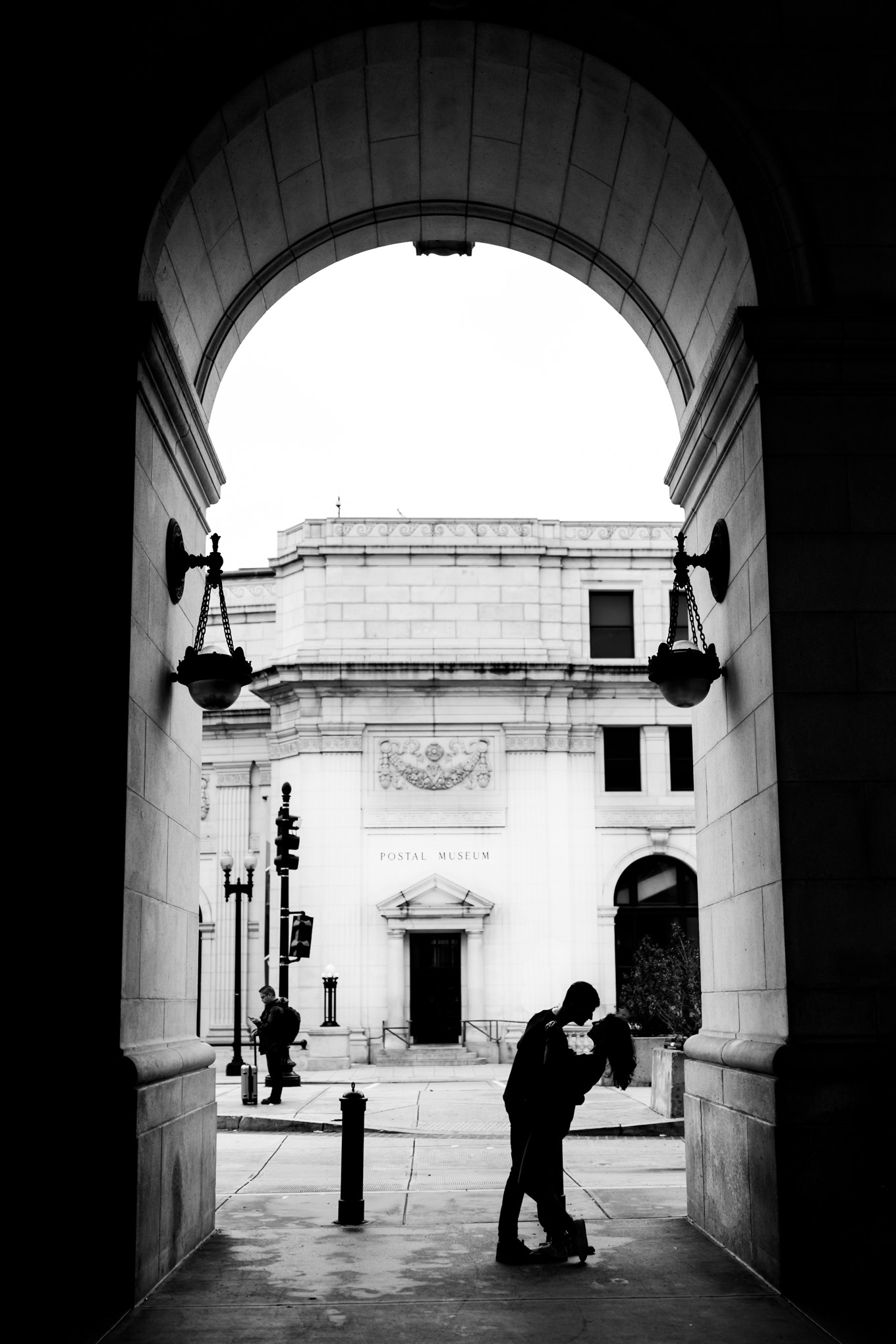 black and white engagement photos, black and white photography, black and white photos, engagement photos, black and white D.C., D.C. engagement photos, classic engagement photos, traditional engagement photos, engagement photos poses, classic architecture, D.C. architecture, Union Station D.C., Union Station, engaged couple, relationship goals, joyful couple, black and white sessions, romantic portraits, couple kissing, silhouette