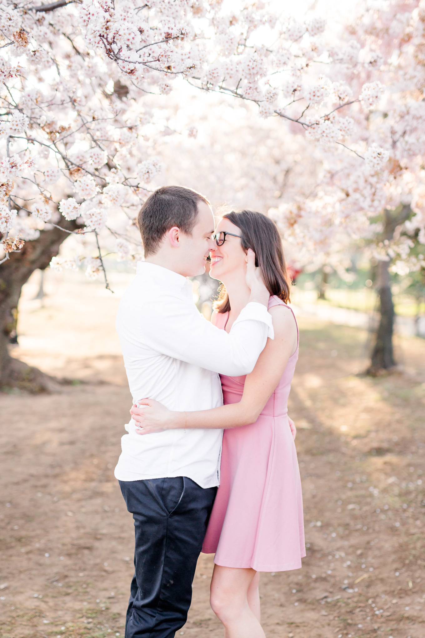 sunny cherry blossoms engagement session, Washington, D.C. engagement photos, Washington D.C. engagement photos, sunrrise engagement photos, cherry blossom engagement photos, D.C. cherry bloossoms, D.C. cherry blossoms photos, cherry blossom photos, cherry blossoms portrraits, sunny engagement photos, classic engagement photos, Rachel E.H. Photography, engagement session style, cherry blossoms forest