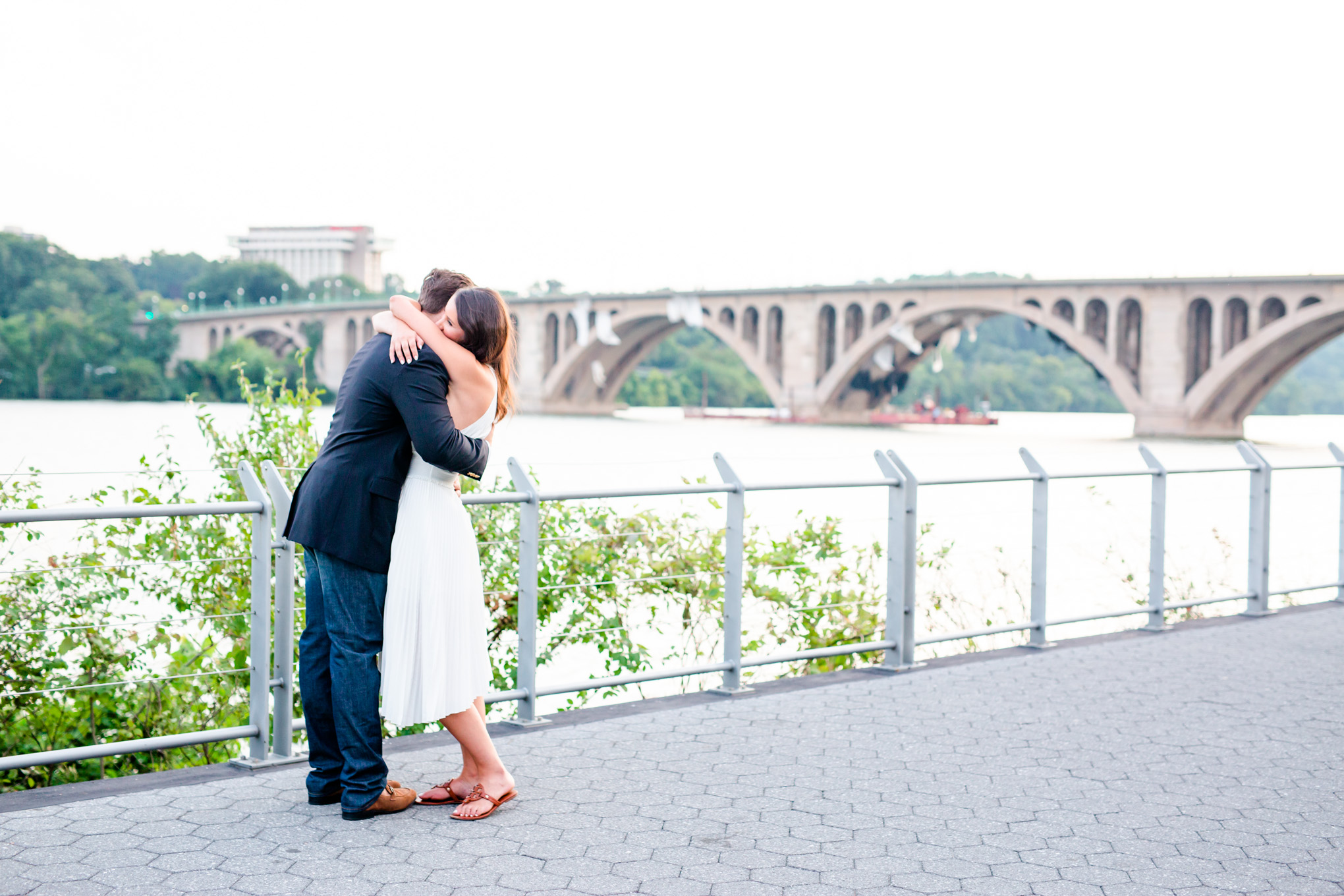 Georgetown waterfront engagement photos, Georgetown waterfront, engagement photos, engagement photo ideas, engagement photos style, D.C engagement photos, D.C. engagement photographer, D.C. wedding photographer, waterfront engagement photos, D.C. couple, sunset engagement photos, sunset portraits, D.C. portraits, romantic portraits, Rachel E.H. Photography, Georgetown, couple hugging, Key Bridge