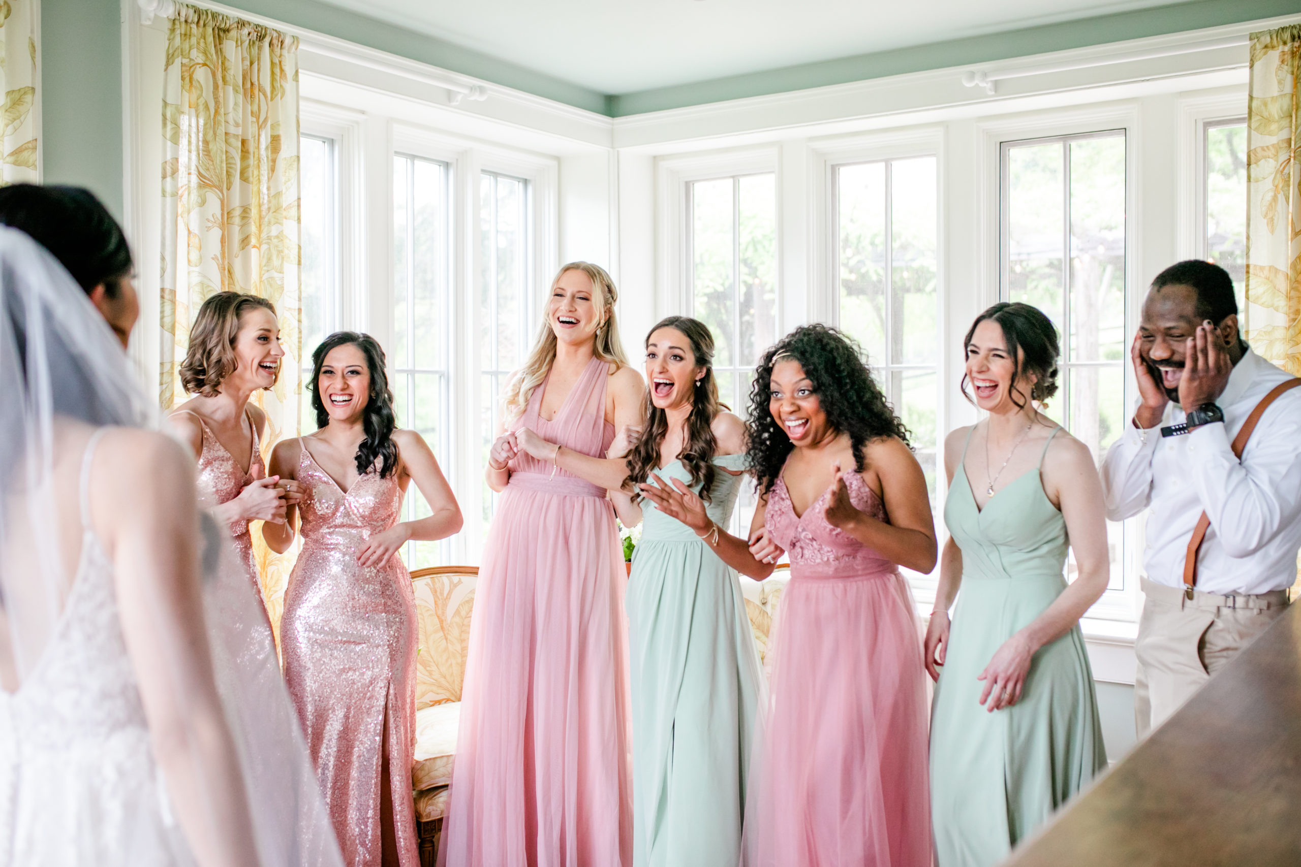 new wedding traditions, wedding photography planning, wedding planning, wedding planning tips, American wedding traditions, wedding ideas, bridesmaids first look, excited bridesmaids, sorbet colored bridesmaids dress