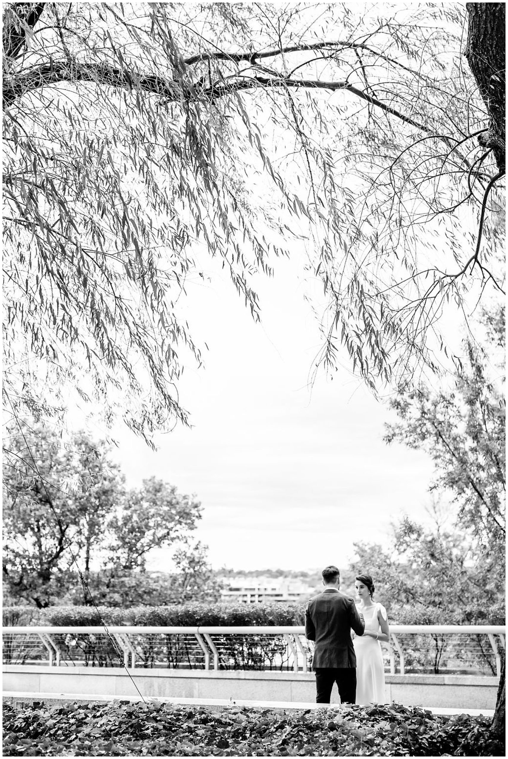 romantic Kennedy Center elopement, Washington DC elopement photographer, Kennedy Center photographer, Kennedy Center portraits, rainy elopement, natural light elopement photography, DC elopement, DC wedding photographer, Rachel E.H. Photography, romantic elopement, black and white, man and woman saying vows from behind tree