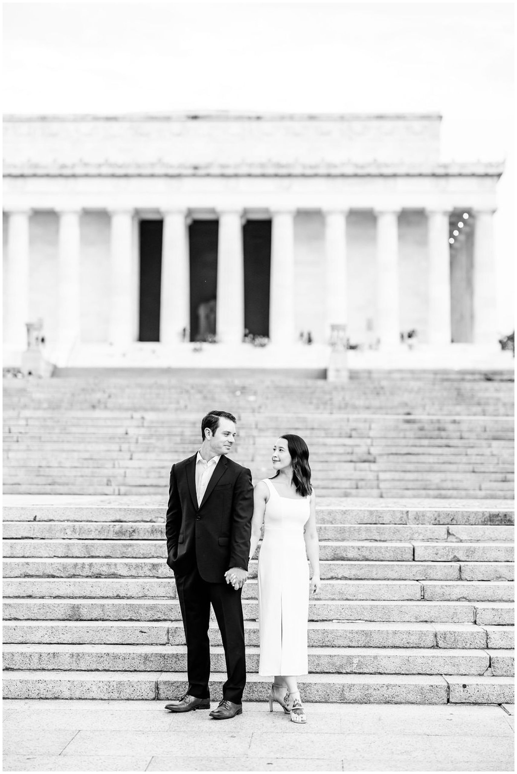 pink sunrise Lincoln Memorial engagement, DC engagement session, DC engagement photographer, formal DC engagement photos, DC elopement photographer, DC wedding photographer, classic DC engagement photos, luxury DC engagement photographer, Rachel E.H. Photography, black and white, couple in front of stairs, stairs leading to lincoln memorial