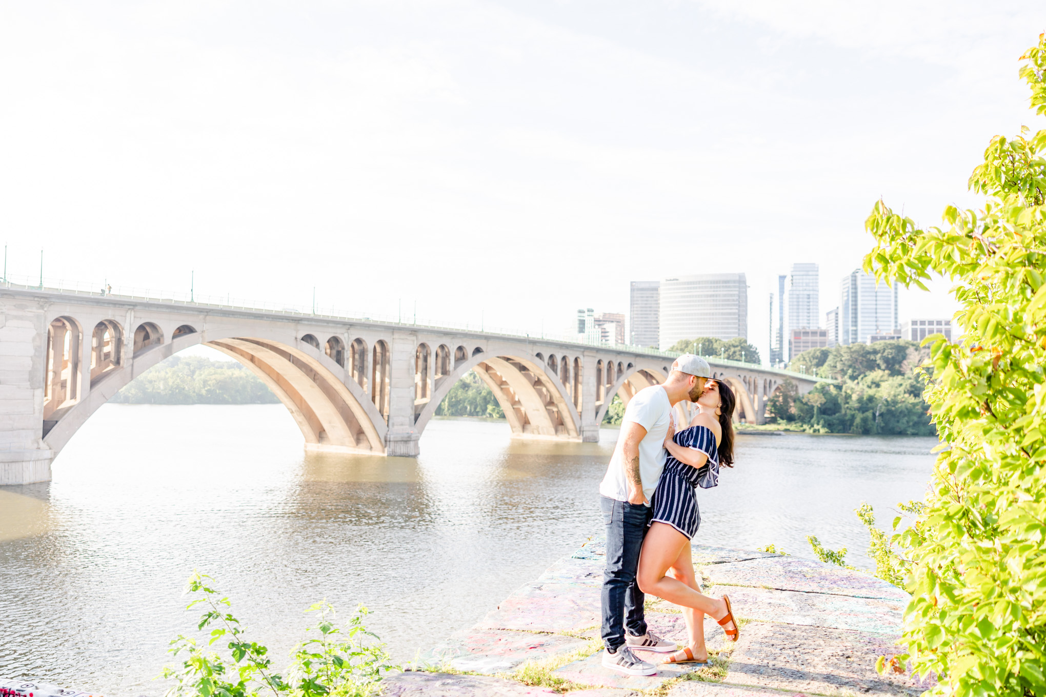 Georgetown waterfront engagement session, Georgetown engagement photos, Georgetown wedding photographer, DC wedding photographer, waterfront engagement photos, Georgetown waterfront engagement photos, DC engagement photos, Rachel E.H. Photography, summer engagement photos, couple kissing in front of Key bridge