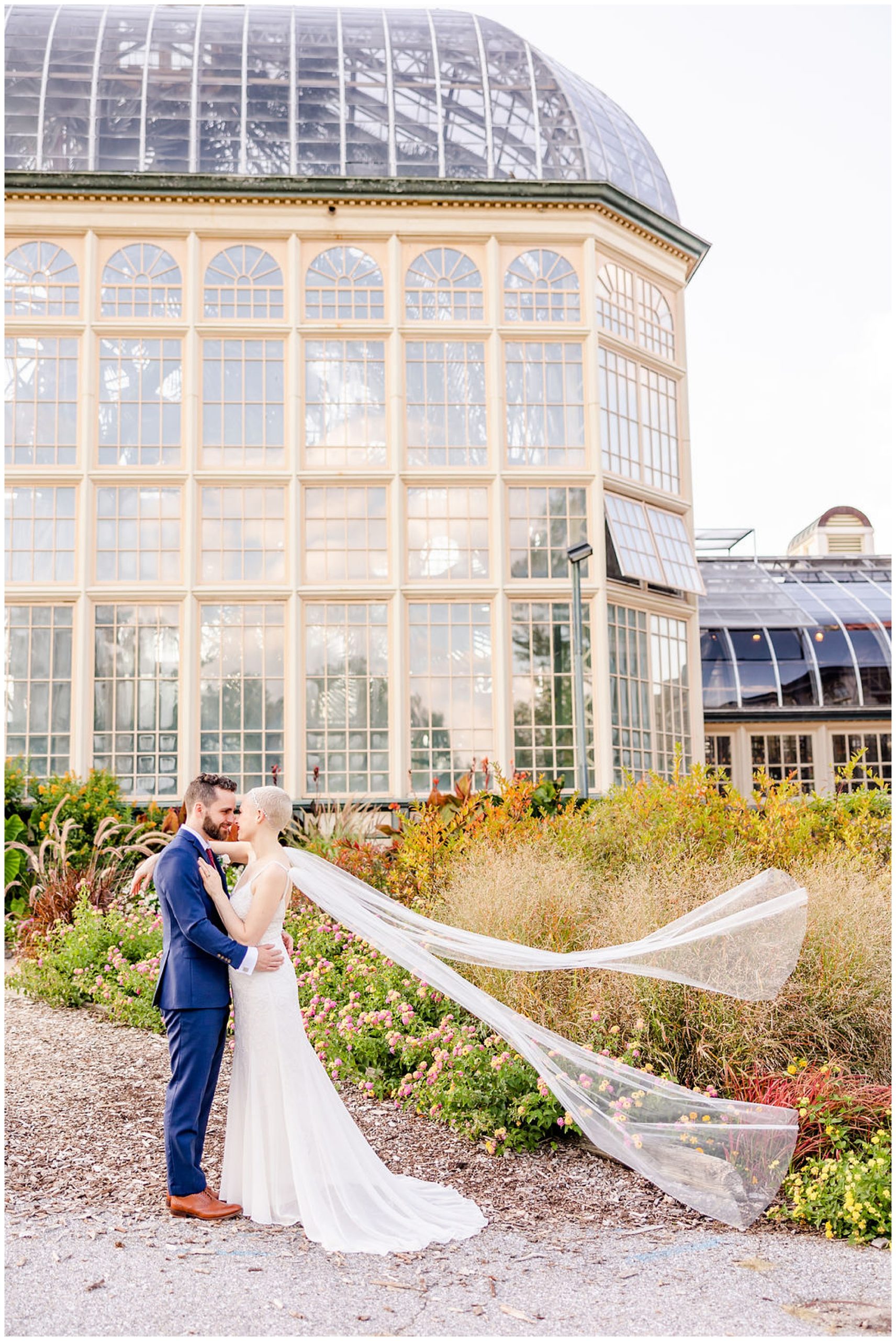 ethereal Rawlings Conservatory wedding, Baltimore wedding venues, Baltimore wedding photographer, Baltimore micro-wedding, Baltimore wedding photography, autumn wedding aesthetic, botanical gardens wedding, Baltimore botanical garden wedding, DC wedding photographer, Rachel E.H. Photography, bridal veil attached to dress, flowing wedding veil, couple looking at each other, Indochino navy suit