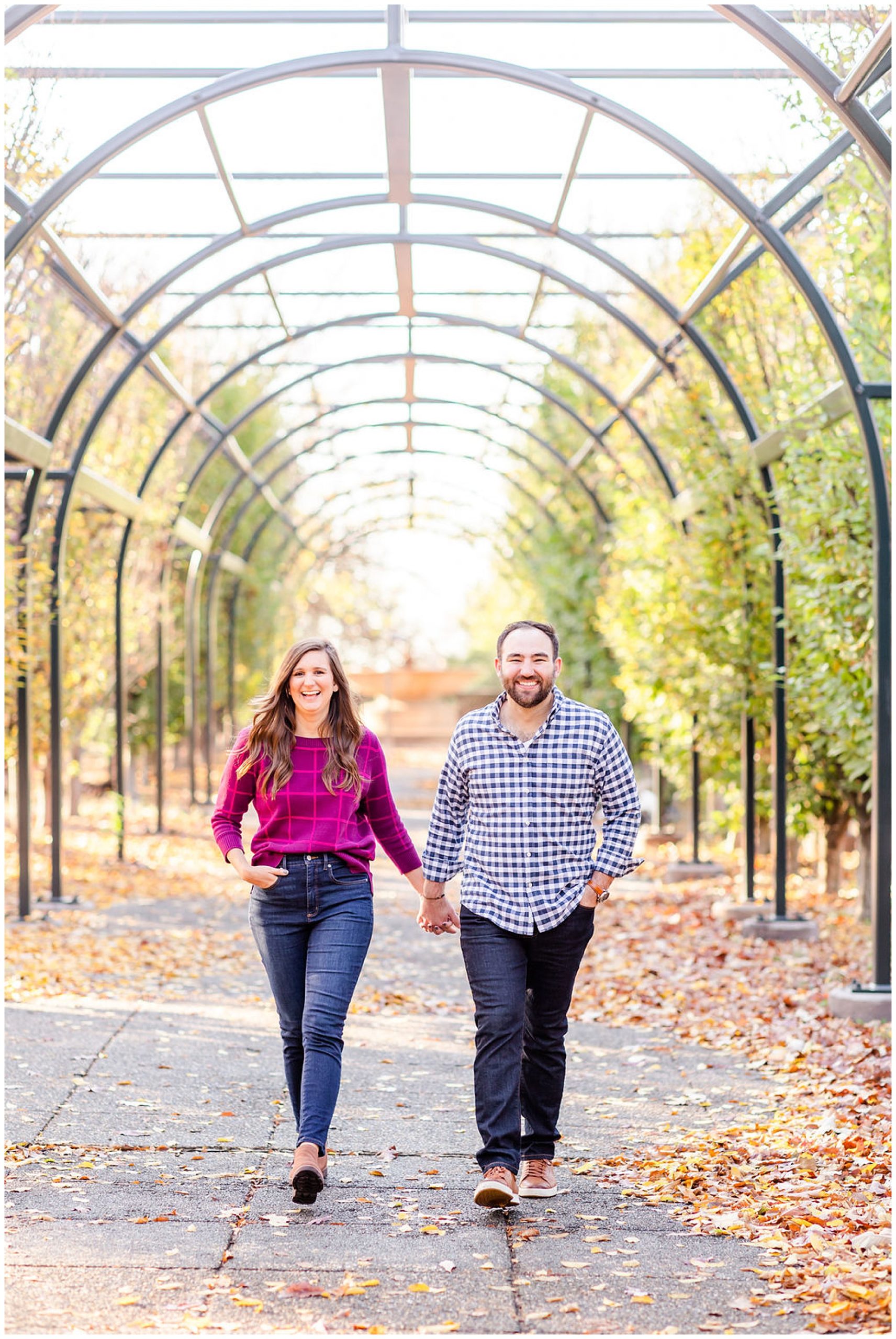 Meridian Hill Park engagement session, Meridian Hill Park DC, DC engagement photography, DC engagement photos, DC engagement session, DC engagement photographer, DC proposal photographer, DC wedding photographer, autumn engagement photos, Rachel E.H. Photography, couple holding hands, couple walking under archway, metal archway