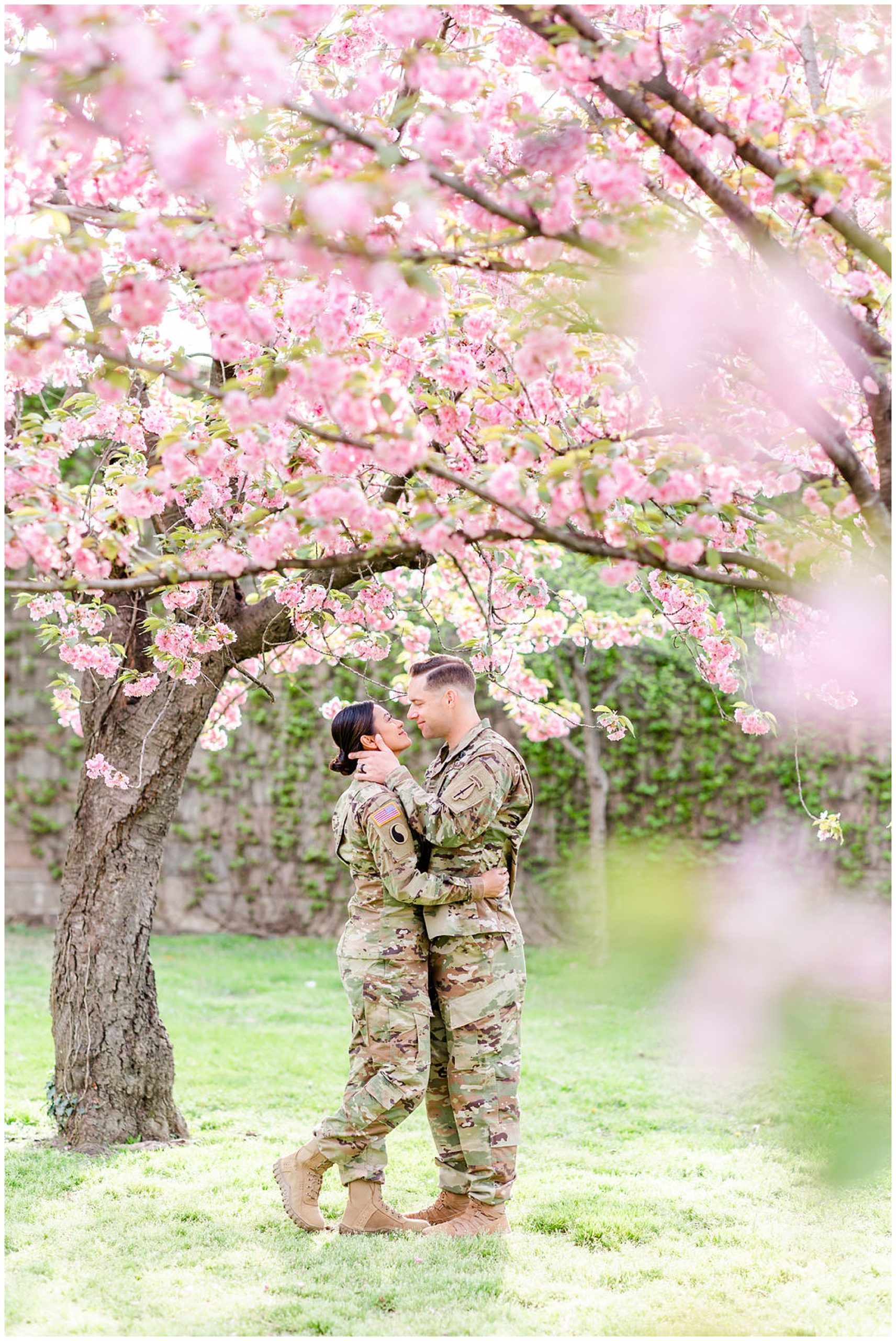 kwanzan cherry blossom portraits, Army couple, D.C. cherry blossom portraits, love birds, romantic portraits, couple goals, military couple, D.C. cherry blossoms photos, spring portraits, newlywed portraits, Rachel E.H. Photography, mans hand on womans cheek, couple with arms around each other