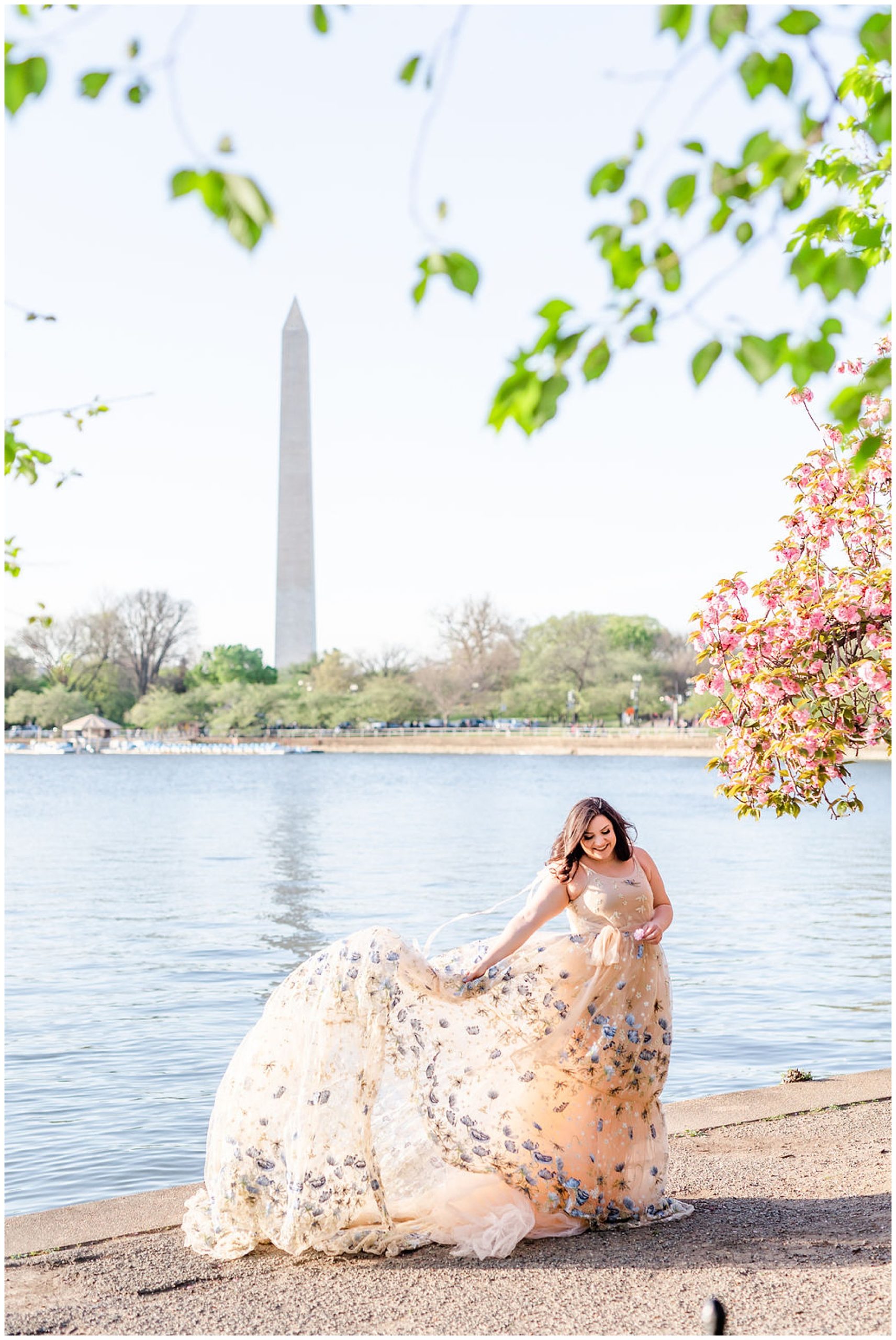 kwanzan cherry blossoms ballgown photos, cherry blossom portraits, kwanzan cherry blossom portraits, D.C. cherry blossoms, spring portriats, just because photos, just because portraits, cherry blossom headshots, Rachel E.H. Photography, woman in front of reflecting pool, dress flowing in wind, lace skirt flowing