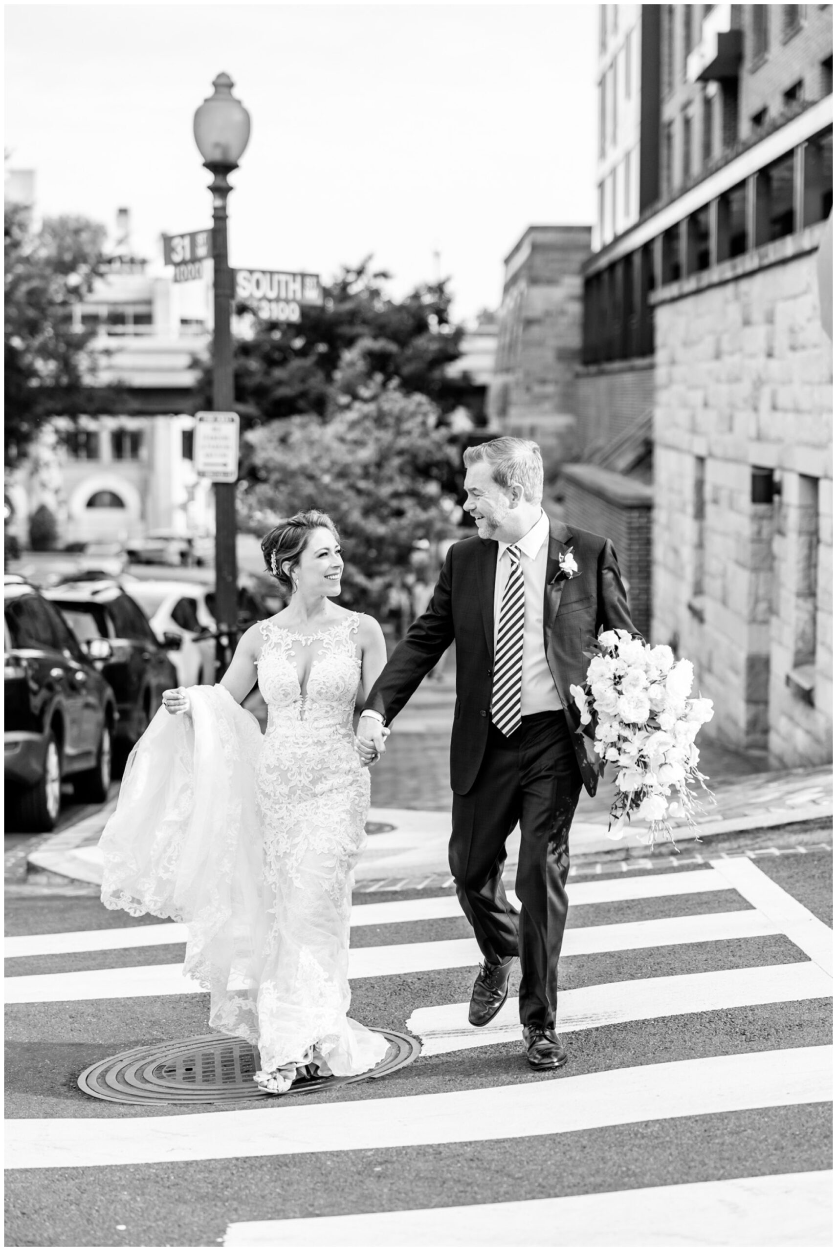 romantic Ritz Carlton Georgetown wedding, summer wedding aesthetic, green and white aesthetic, summer D.C. wedding, D.C. wedding venues, Ritz Carlton wedding, Washington D.C. wedding, romantic wedding aesthetic, Georgetown wedding, Rachel E.H. Photography, D.C. photographer, couple holding hands, black and white, bride and groom walking down sidewalk, groom holding bouquet