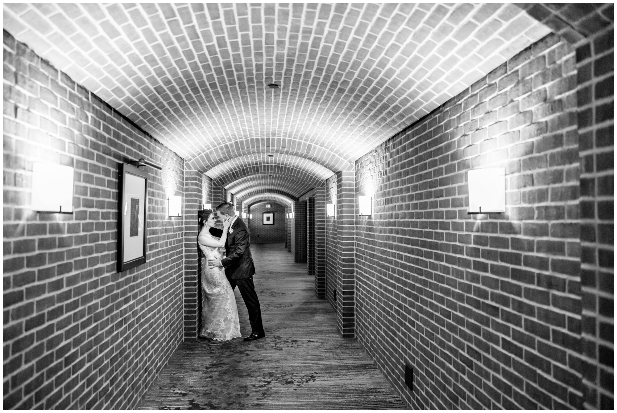 romantic Ritz Carlton Georgetown wedding, summer wedding aesthetic, green and white aesthetic, summer D.C. wedding, D.C. wedding venues, Ritz Carlton wedding, Washington D.C. wedding, romantic wedding aesthetic, Georgetown wedding, Rachel E.H. Photography, D.C. photographer, bride and groom against wall, brick tunnel, black and white